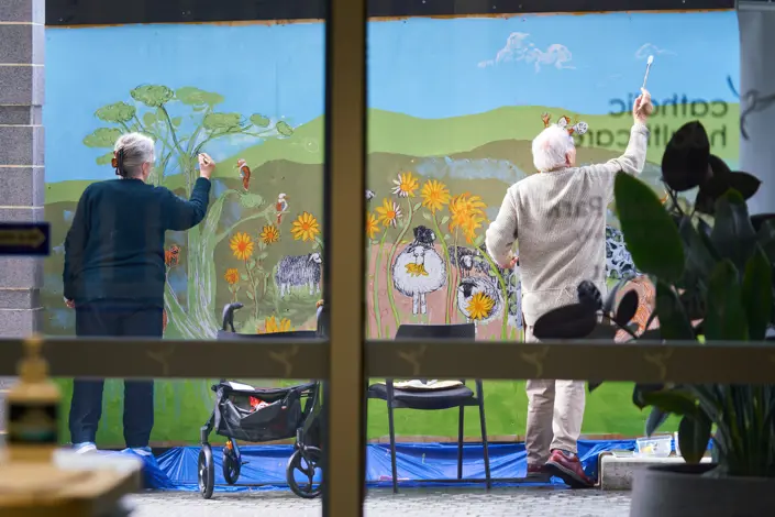 Residents at McQuoin Park Retirement Village colour their world with a mural 
